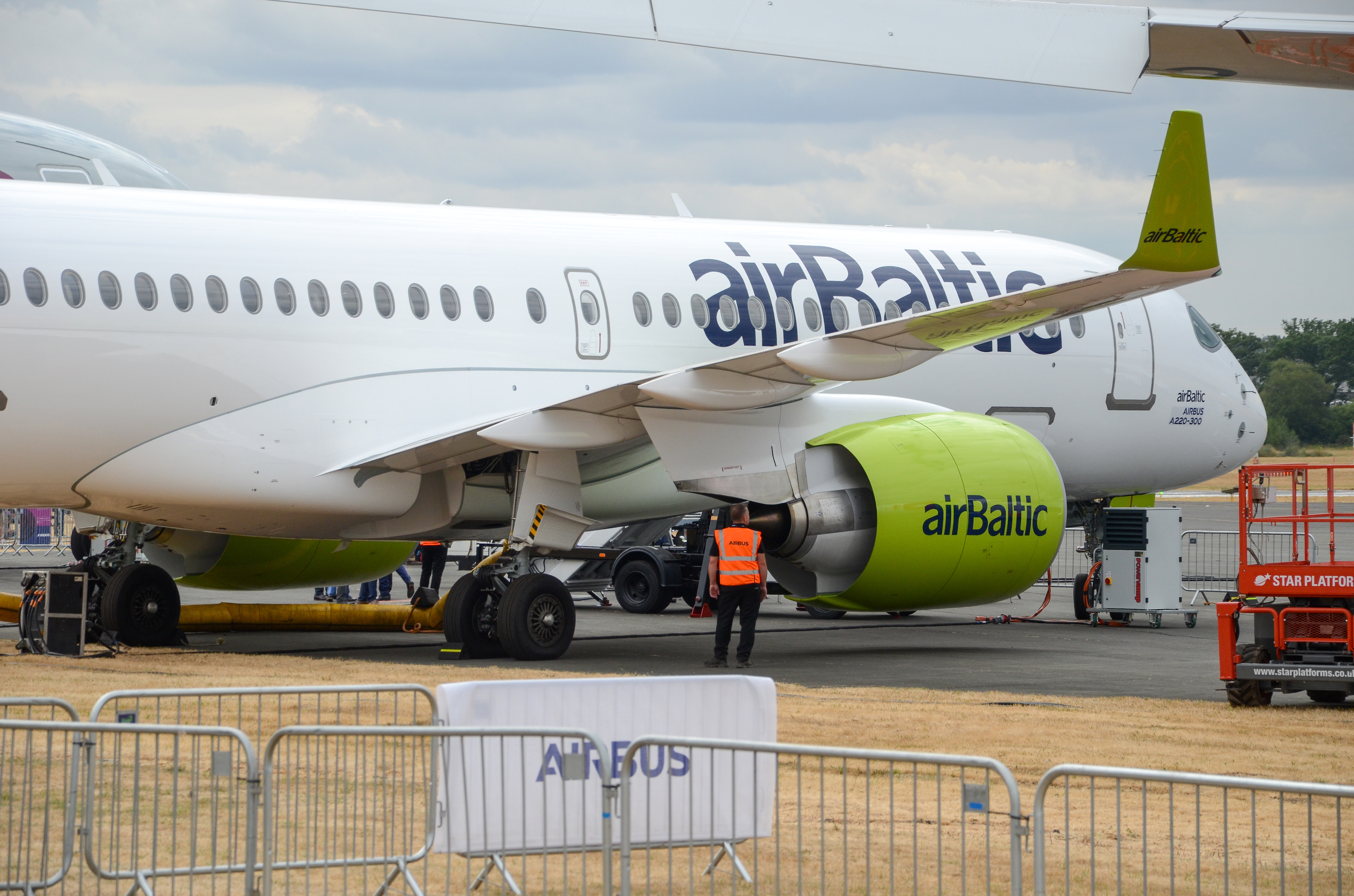 An AirBaltic Airbus A220-300 on display at the 2018 Farnborough International Airshow.