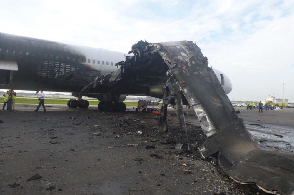 The charred remains of an American Airlines Boeing 767-300ER at Chicago's O'Hare Airport after an uncontained engine failure during its takeoff roll. The accident prompted significant concerns from the NTSB regarding passengers' open disregard for cabin crew instructions to leave carry-on baggage and their potential for significant interference with an expeditious evacuation. The aircraft was written off by the airline.