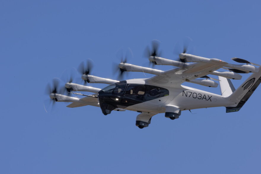 Archer's prototype Midnight aircraft N703AX shown against a blue sky during a 55-mile piloted CTOL flight in Salinas, California in August