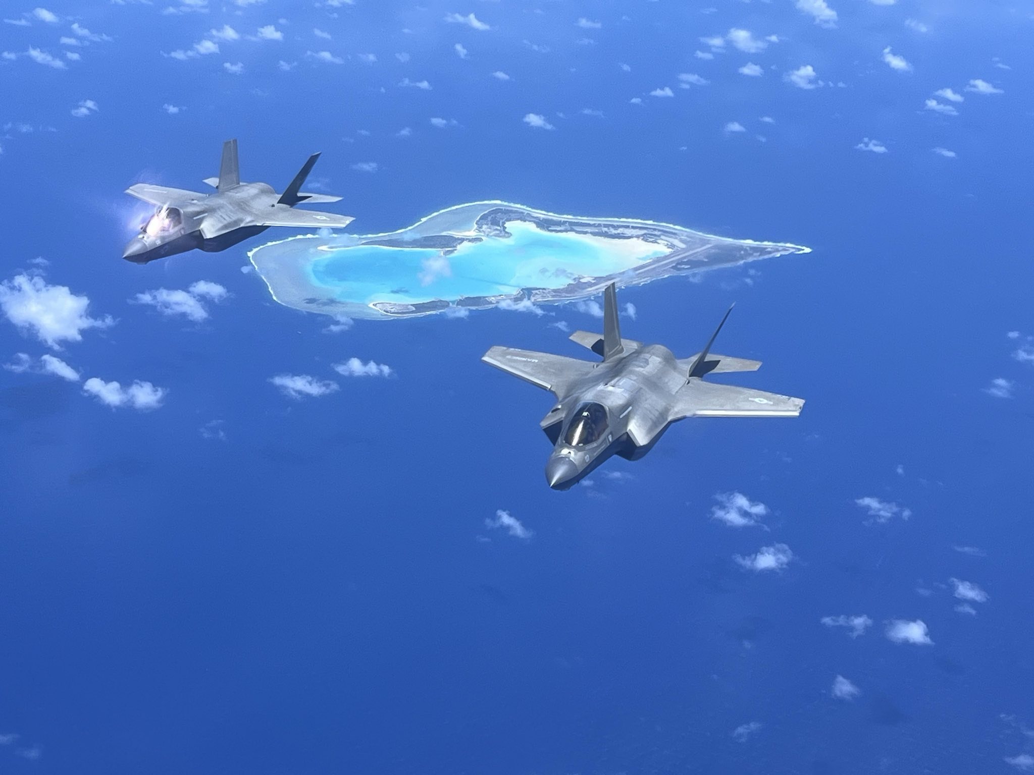 Two F-35B Lightning IIs in flight over Wake Island