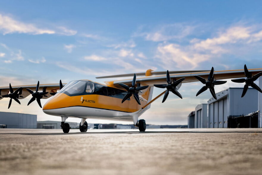 Rendering of Electra EL9 ultra-STOL aircraft sitting on airport ramp against a blue sky with wispy clouds